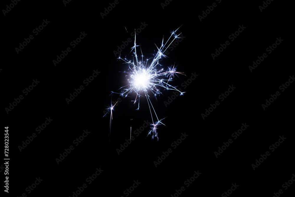 Aufkleber fireworks bengal flicker on a dark background. easy to add lens flare effects for overlay designs or