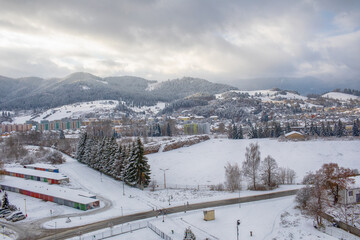 View of a town in winter season.Mountains in background.