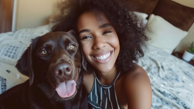 Smiling african americane young girl with lovely dog taking selfie in a hotel room. Pet friendly hotel, friendship, relax, social media profile picture and memory, influencer, pet owner 