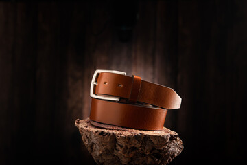 Fashionable men leather belt on a wooden - 728032701