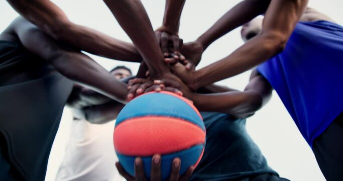 Teamwork, people or hands for motivation, basketball or solidarity for group mission, unity or support. Training game, low angle or athletes in huddle for exercise, fitness or workout in sports match
