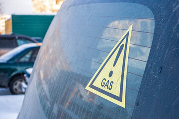 sticker on a car warning that the car is powered by propane gas fuel