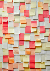 pastel colored post-it notes on a wall