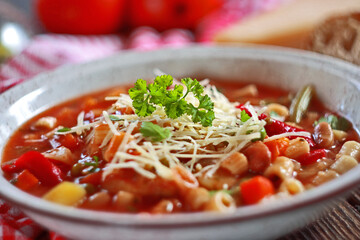Minestrone soup with pasta and vegetables. Italian food. Selective focus.
