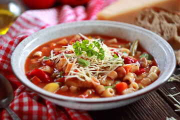 Minestrone soup with pasta and vegetables. Italian food. Selective focus.
