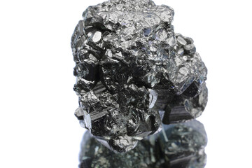 small gray shiny metallic nugget just found by searchers on white background