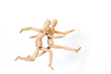 Wooden men in motion. The concept of people's relationships. Friends.Wooden doll Used to simulate human gestures.