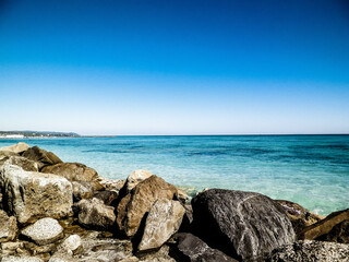 Fototapeta na wymiar Stones on beach in Vada, Italy.