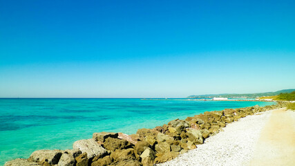 Breakwater on beach in Vada, Italy.