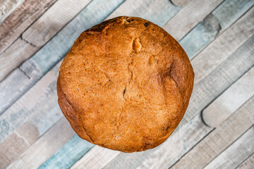 Close up with traditional Italian panettone sweet bread pastry with dried fruits. Holyday baked fruitcake.