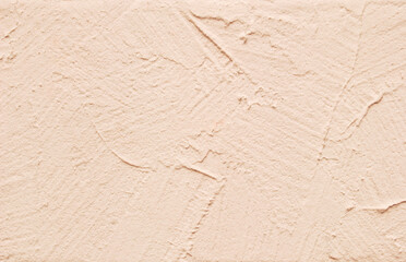 Beige decorative painted plastered wall texture as background