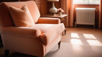 The interior of the living room is decorated in delicate peach tones. A soft sofa stands by the window, in the sunlight.