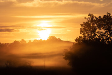 Fototapeta na wymiar misty sunrise