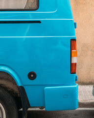 Vibrant Blue Vintage Van Parked on an Urban Street