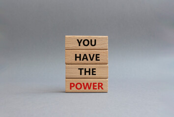 You have the Power symbol. Concept words You have the Power on wooden blocks. Beautiful grey background. Business and You have the Power concept. Copy space.