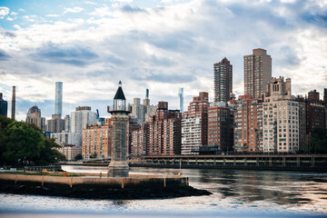 A view of the upper East Side in Manhattan with the East River in the foreground seen from Roosevelt Island in New York City, United States. - 728071352