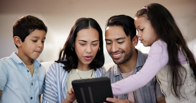Tablet, smile and children with parents on sofa choosing movie, film or show on internet at home. Happy, bonding and kids with mother and father to select video on digital technology in living room.