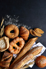 Homemade fresh baked bread with flour and ears. Top view with copy space.