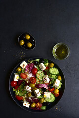 Fresh vegetable salad with feta cheese. Top view with copy space.