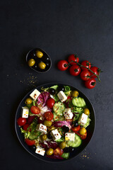 Fresh vegetable salad with feta cheese. Top view with copy space.