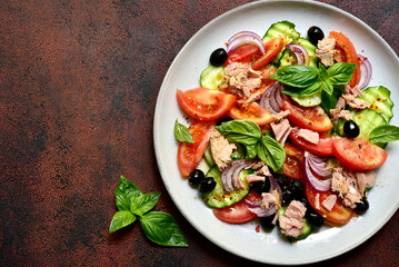 Fresh vegetable salad with tuna. Top view with copy space.