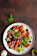 Fresh vegetable salad with tuna. Top view with copy space.