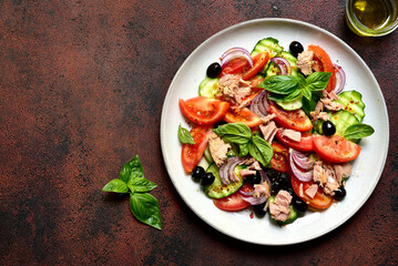 Fresh vegetable salad with tuna. Top view with copy space.
