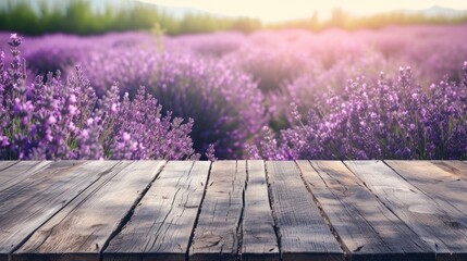 an empty wooden table against the background of a lavender field. display your product outdoors. lilac flowers.