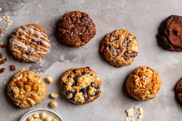 Irresistible flat lay arrangement of delicious chocolate, blueberry, almond, and peanut cookies....