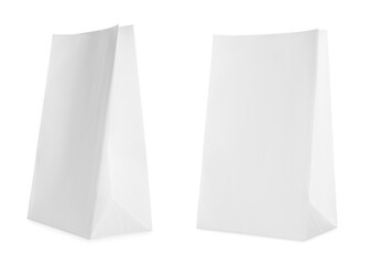 Open white paper bags isolated on white