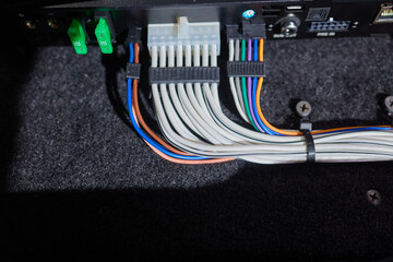 Technician installing the car audio processor Car audio installation concept.