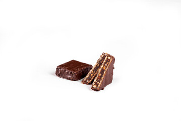 Chocolate candy with wafer and nuts on white background