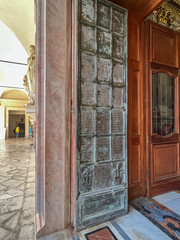  Open door to the interior of the monastery at the Benedictine abbey on Monte Cassino in Italy - obrazy, fototapety, plakaty