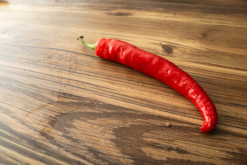 red pepperoni chili pepper on wooden background