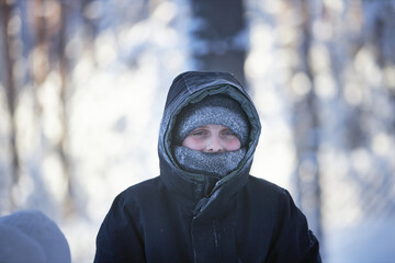 Young Boy in Snow With Hooded Jacket © justoomm
