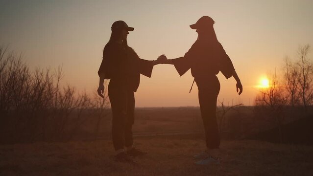 two female athlete have fitness workout and exercise on fresh open air at sunset