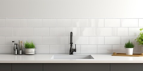 Fototapeta premium White ceramic tiles used as copy space in an industrial kitchen with a black faucet, creating a banner-like panorama.