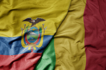 big waving national colorful flag of mali and national flag of ecuador .