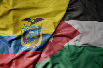 big waving national colorful flag of jordan and national flag of ecuador .