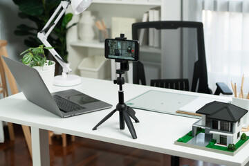 All equipment sets for architecture recording by smartphone standing on white desk consist of...