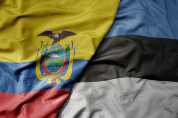 big waving national colorful flag of estonia and national flag of ecuador .