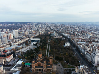 The drone view of the St. Mark's Church in the historical downtown center of Belgrade at sunset.