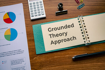 There is notebook with the word Grounded Theory Approach. It is as an eye-catching image.
