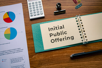 There is notebook with the word Initial Public Offering. It is as an eye-catching image.