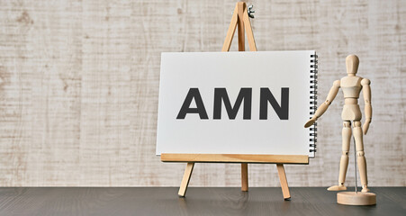 There is notebook with the word AMN. It is an abbreviation for Artifical Mains Network as...