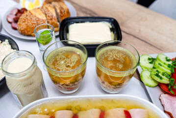 Traditional dishes from Poland for Easter breakfast, visible chicken in jelly in a glass.
