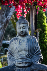 Buddha in the garden in blossom