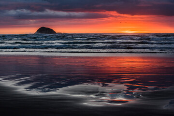 Sunset at the beach with reflection of colorful light