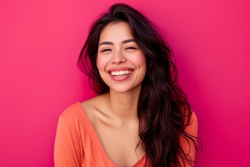 Fototapeta premium Portrait of a Joyful Young Woman Laughing on Pink Background. Generative AI.