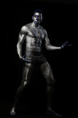 Fototapeta na wymiar Sexy Black Male Silver Color Body Art